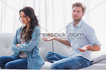 Woman with arms crossed back to her partner