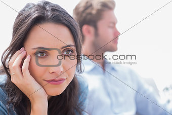 Thoughtful woman holding her head