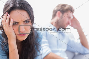 Irritated woman holding her head
