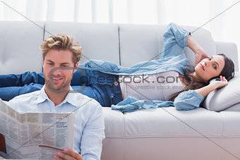 Woman relaxing on a couch listening to music