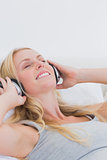 Pretty woman listening to music with headphones