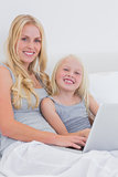 Mother and daughter using a laptop
