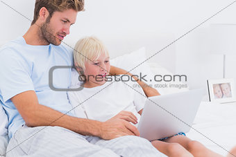 Father and son using a laptop