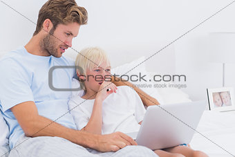 Handsome father and his son using a laptop