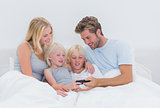Beautiful family using a smartphone