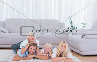 Family lying on the carpet