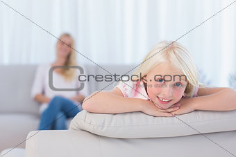 Little girl lying on the couch