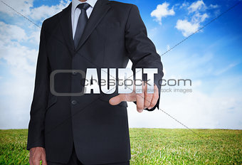 Businessman selecting audit word