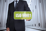 Businessman selecting a green label with iso 9001