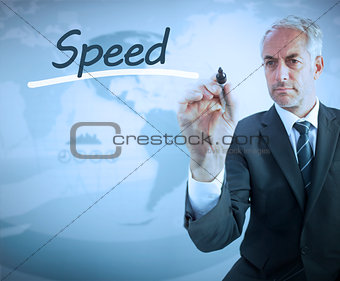 Businessman writing the word speed