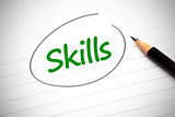 Skills word written in green on a notepad