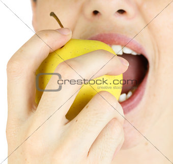 Girl taking a bite of an apple.