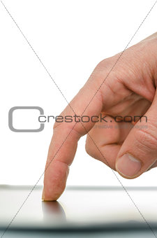 Close up of male finger working on a tablet computer