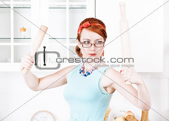 Beautiful housewife with rolling pin