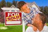 Mixed Race Father and Son In Front of Real Estate Sign and House