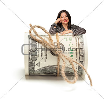 Hispanic Woman Leaning on a Roll Of Hundred Dollar Bills