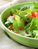 fresh healthy salad with tomatoes and arugula
