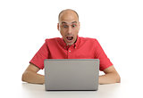 shocked young man with his laptop computer