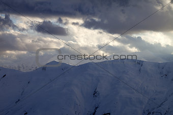 Snow mountain and storm clouds