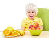 little girl with healthy food sitting at table isolated on white