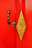 Closed up red handle door in temple