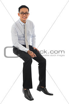  Asian businessman sitting on a transparent block