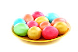 Easter colored eggs on a plate.