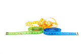 Three measuring tapes of different colors