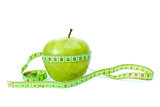 Green apple and measurement tape