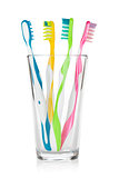 Colorful toothbrushes in glass