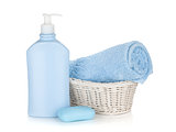 Shampoo bottle, soap and blue towel