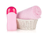 Shampoo bottle and pink towel