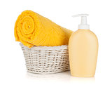 Shampoo bottle and yellow towel