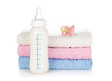 Baby bottle, pacifier and towels