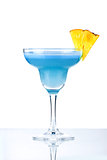 Blue alcohol cocktail with pineapple