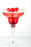 Red tropical cocktail with cherry
