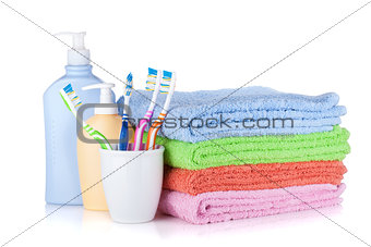 Toothbrushes, shampoo bottles and colored towels