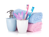 Toothbrush, soap, two towels and flower