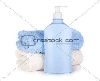 Shampoo bottle and towels