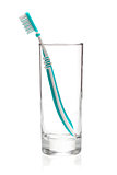 Green tooth brush in glass