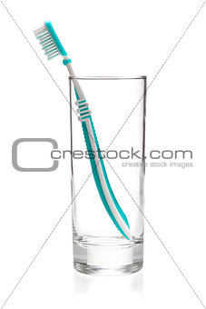 Green tooth brush in glass