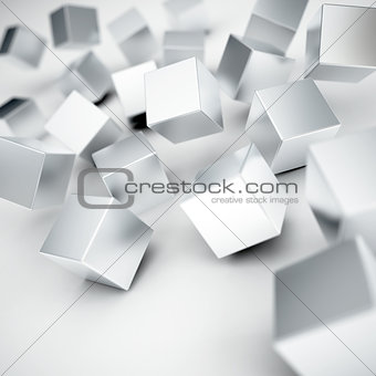 Falling and hitting gray metallic cubes on a white background
