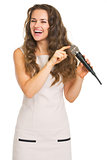 Happy young woman checking microphone