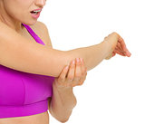 Closeup on woman with elbow pain