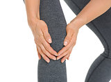 Closeup on woman with knee pain