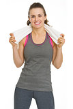 Portrait of smiling fitness young woman with towel