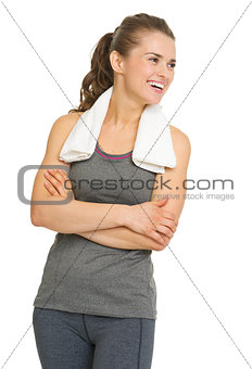 Portrait of happy fitness young woman looking on copy space