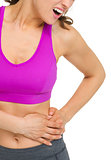 Closeup on woman with stomach pain