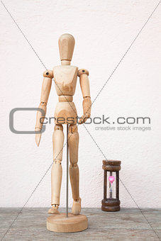 Wooden mannequin pose in concept of progress time  
