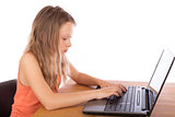 Young girl working on a laptop